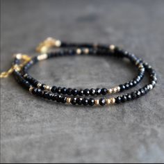 Our Beaded Black Spinel Choker Necklace Is Dainty, Elegant, Perfect For Layering! Comes In A Beautiful Gift Box With Velvet Jewelry Pouch . D E T A I L S Natural Black Spinel Beads Are Sparkly Micro Faceted Handmade In The Usa Bead Size: 2.9mm Randomly Scattered 2mm 925 Sterling Silver Or 14k Gold Filled Beads Available In 3 Sizes. 14" + 1" Choker 16" + 1" Collar 18" + 1" Necklace This Listing For The Choker Crystal Information, Black Tourmaline Necklace, Crystal Necklaces, Gemstone Beaded Necklace, Dainty Gold Necklace, Protection Necklace, Tourmaline Necklace, Gold Choker Necklace, Tourmaline Beads