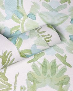 an upholstered wallpaper with green and blue watercolor flowers on white paper