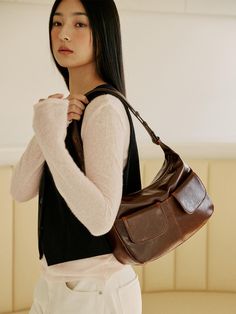 It is a daily bag brand that can be used comfortably every day.- Practical design with two out pockets- Open and close with the hidden magnet- Can be worn as a shoulder bag or a cross bag- Vintage and natural mood Brown On-the-go Shoulder Bag With Pockets, Modern Brown Saddle Bag For Daily Use, Modern Brown Saddle Bag For On-the-go, Versatile Brown Baguette Bag For Travel, Brown Large Capacity Shoulder Bag For Daily Use, Brown Baguette Shoulder Bag For On-the-go, Versatile Everyday Brown Saddle Bag, Modern Brown Baguette Bag For Daily Use, Modern Brown Baguette Bag For Everyday Use