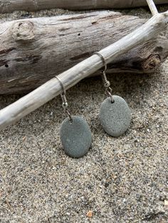 These unique beach stone earrings are hand-crafted in New England using sterling silver earring wires. The earrings are light-weight and add an elegant touch of the seaside, making them the perfect gift- or a little something special for yourself! Photos show just a small selection of possible options!  Contact me to view even more size/shape choices. Due to the natural variations in beach stones, please expect very slight differences in the gray stone color and oval shapes. Rock Earrings, Earrings Beach, Natural Stone Earrings, Unique Beach, Earring Wires, Beach Stones, The Seaside, Beach Glass, Grey Stone