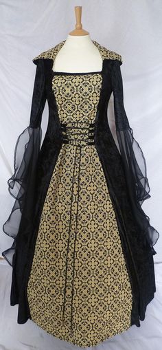 a black and gold dress on a mannequin