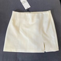 Cream Mini Skirt From Zara, Size M, Brand New Tags Still Attached. Elegant Zara Mini Skirt Lined, Chic Zara Pencil Skirt For Spring, Zara Relaxed Mini Skirt With Lining, Zara Mini Skirt For Day Out, Elegant Zara Skort For Summer, Chic High Waist Mini Skirt By Zara, Chic Zara Mini Length Skort, Chic Zara Mini Skort, Zara High-waist Lined Skort