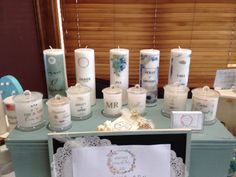 a table topped with lots of candles and cards