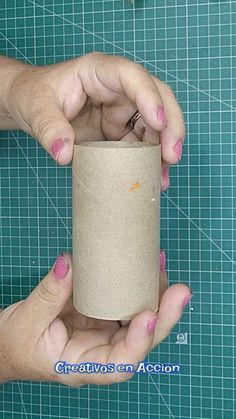 two hands holding a roll of toilet paper