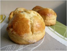 two bread rolls sitting on top of a table