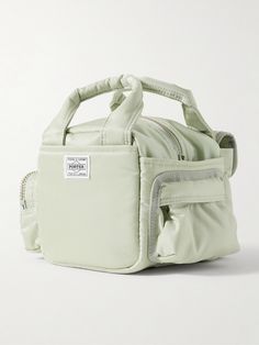 Sacai teams up with Japanese label Porter-Yoshida & Co to create a lineup of bags that combine both brands' unexpected and utilitarian-inspired aesthetics. This scaled-down 'Boston' tote bag has been made in Japan from hardwearing nylon and is fitted with plenty of pockets with a variety of fastenings. It has enough space for your wallet, sunglasses and AirPods. Tote Bag For Men, Nylon Tote Bag, Porter Yoshida, Nylon Tote Bags, Nylon Tote, Green Bag, Mr Porter, Made In Japan, Boston