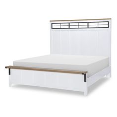 the bed frame is made with white wood and metal trims, along with a wooden slatted headboard