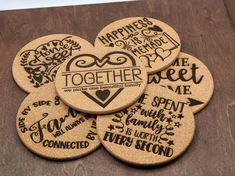 four coasters that say together and have different words on them, all in black ink