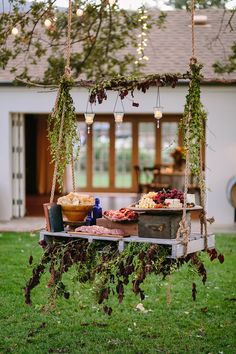 a table with food on it in the grass