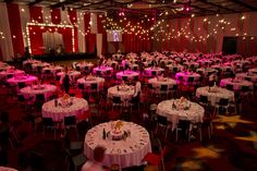 a large banquet hall with tables and chairs