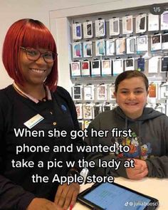 a woman sitting at a table with a boy in front of her and an apple store