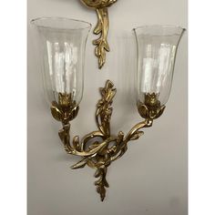 Imagine these Rococo cast brass candle sconces flanking a beautiful mirror over a sideboard or entry table. Wherever you use them they will add elegance .  Each arm extends from intertwined “branches” and the candle cups have a tulip like design. The candle cups have clips to hold the original glass globes. The ribbed and fluted globes are hand blown and thin . Each has the signature bubbles and striations from the blowing process. One striation is shown - it is not a crack but a mark actually i Candle Cups, Beautiful Mirror, Glass Globes, Candle Wall Sconces, Candle Cup, Beautiful Mirrors, Brass Candle, Entry Table, Wall Candles