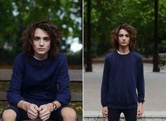 two photos of a young man sitting on a park bench, one with curly hair and the other without