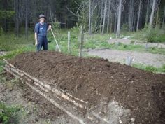 a man standing on top of a pile of dirt