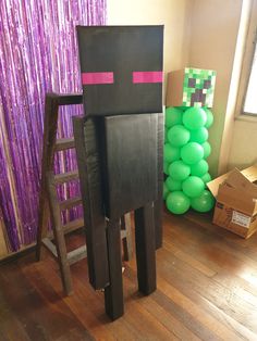 an image of a minecraft man made out of wood and plastic balloons on the floor