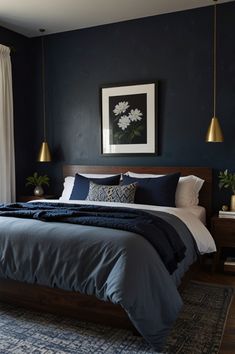 a bedroom with dark blue walls and white bedding