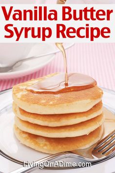 a stack of pancakes with syrup being drizzled over them on a plate