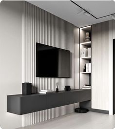 an entertainment center with a flat screen tv mounted on the wall