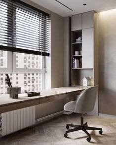 an office with a desk and chair next to a window