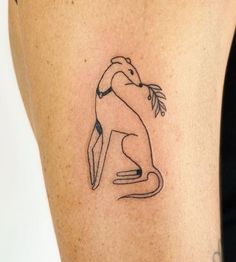 a woman's arm with a tattoo on it that is shaped like a kangaroo