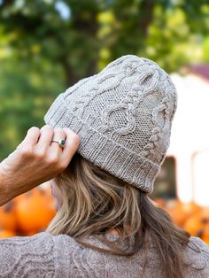 A warm cap to knit in three sizes (S/M/L) that will be much appreciated by any family member when the cold winds blow. Simple cable crosses in a vertical pattern create a neat, modern motif that is engaging to knit and delicious to wear. Knit in a round tightly twisted yarn for crisp stitch definition and a snug fit; for a softer texture and fit, work in a relaxed yarn or fiber blend. May be worked with a shorter, single brim (instructions included). Samples shown are size M (hers) and size L (h Swirl Hat, Blanket Cardigan, Halloween Kit, Charming Eyes, Cable Hat, Vertical Pattern, Rib Stitch, Aran Weight Yarn, Deep Winter