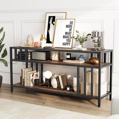 a living room with a book shelf filled with books and other items next to a potted plant