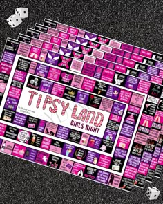 a board game with dices on the floor and words written in pink, white and black