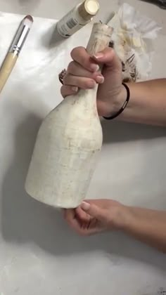 someone is making something out of toilet paper