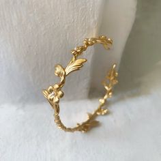 This dainty and intricate floral branch bracelet consists of a swirly branch like design loaded with lots of little forger-me-not flowers. It has two branches loaded with lots of lovely flowers growing out of each side. It has a tiny little pearl in the center of each flower.The metal base is flexible so it is very easy to adjust it to the wrist for a comfortable fit. * Comes wrapped in a beautiful gift package.* Could be requested in either 14k gold, rose gold or silver plated brass.For updates Gold Flower Bracelet, Branch Bracelet, Gold Wrap, Floral Bracelet, Jewelry Bridesmaid, Bohemian Bracelets, Wire Bracelet, Flower Bracelet, Jewelry Inspo