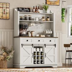 a kitchen with white cupboards and shelves filled with wine bottles, coffee mugs and other items