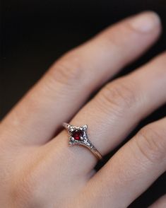 A dainty, mischievous ring created using the cast in place method. Lily Streeter sets each stone is set directly into the wax and hand textures each piece before casting. No two rings exactly alike. Lab-created simulation Amethyst (corundum) *Please note - This stone comes in a variety of shades and may not exactly match the stone shown on this listing. If you prefer a lighter or darker shade amethyst, please leave a note in the comments section of your order. For yellow, rose gold or other ston Garnet Stone Ring, Two Rings, Garnet Stone, Dark Shades, Garnet Rings, Natural Sapphire, Yellow Rose, Pink Sapphire, The Cast