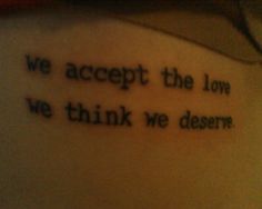 a tattoo saying we accept the love we think we deserves on someone's arm