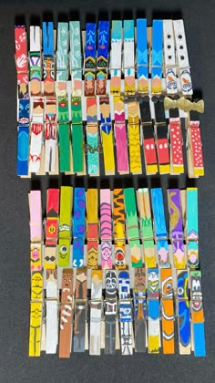 several rows of colorful wooden watches on display