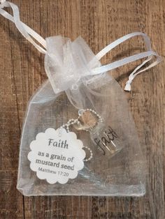 a clear bag with a keychain that says faith as a grain of mush and seed