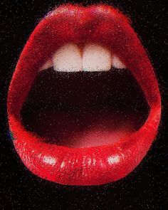 a close up of a red lip with white tips on it's tip and black background