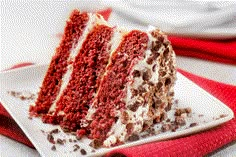 a slice of red velvet cake on a white plate