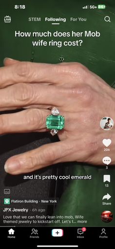 a woman's hand with an emerald ring on her finger and the text, how much does her mob wire ring cost?