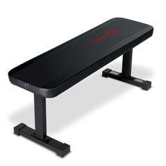 a black bench sitting on top of a white floor next to a red and black object