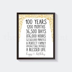 a framed poster with the words 100 years in black and gold glitters on it