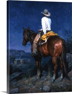 a man riding on the back of a brown horse in front of a night sky