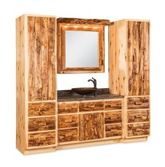 a bathroom vanity with wooden cabinets and mirror