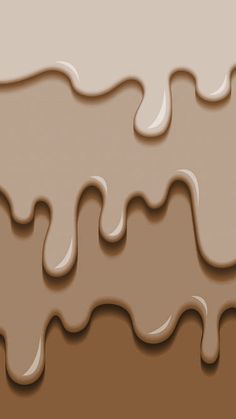 some brown and white liquid flowing down the side of a chocolate cake with icing on it