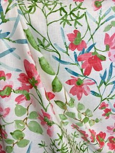 the fabric has flowers on it and green leaves