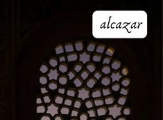 an ornate window with the word alcazar written below it