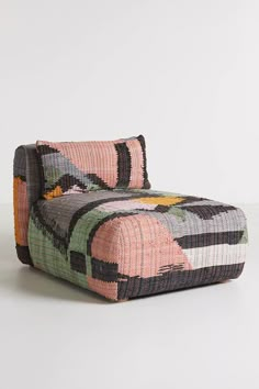 a chair made out of woven material with colorful patterns