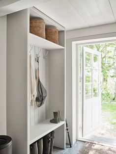 the entryway is clean and ready to be used as a storage area for shoes