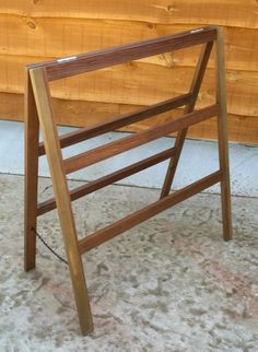 a wooden chair sitting on top of a carpeted floor