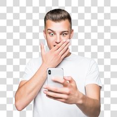 a man covering his mouth with his hand while holding a cell phone in front of him