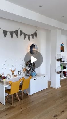 a living room filled with furniture and lots of decorations on the wall next to bookshelves