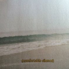 a blurry photo of an ocean with waves coming in from the shore and text that reads comfortable able science